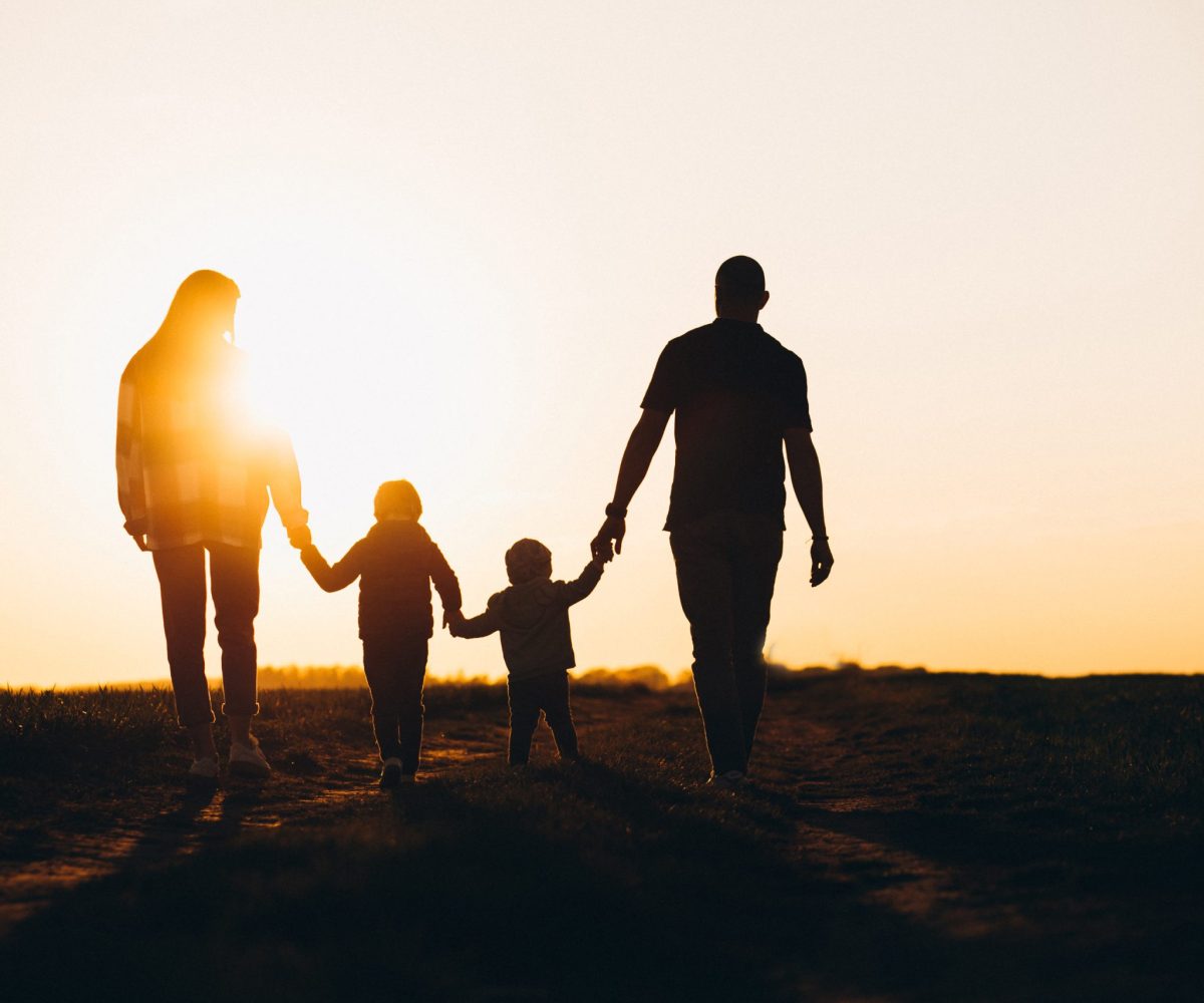 Happy family silhouette on the sunset